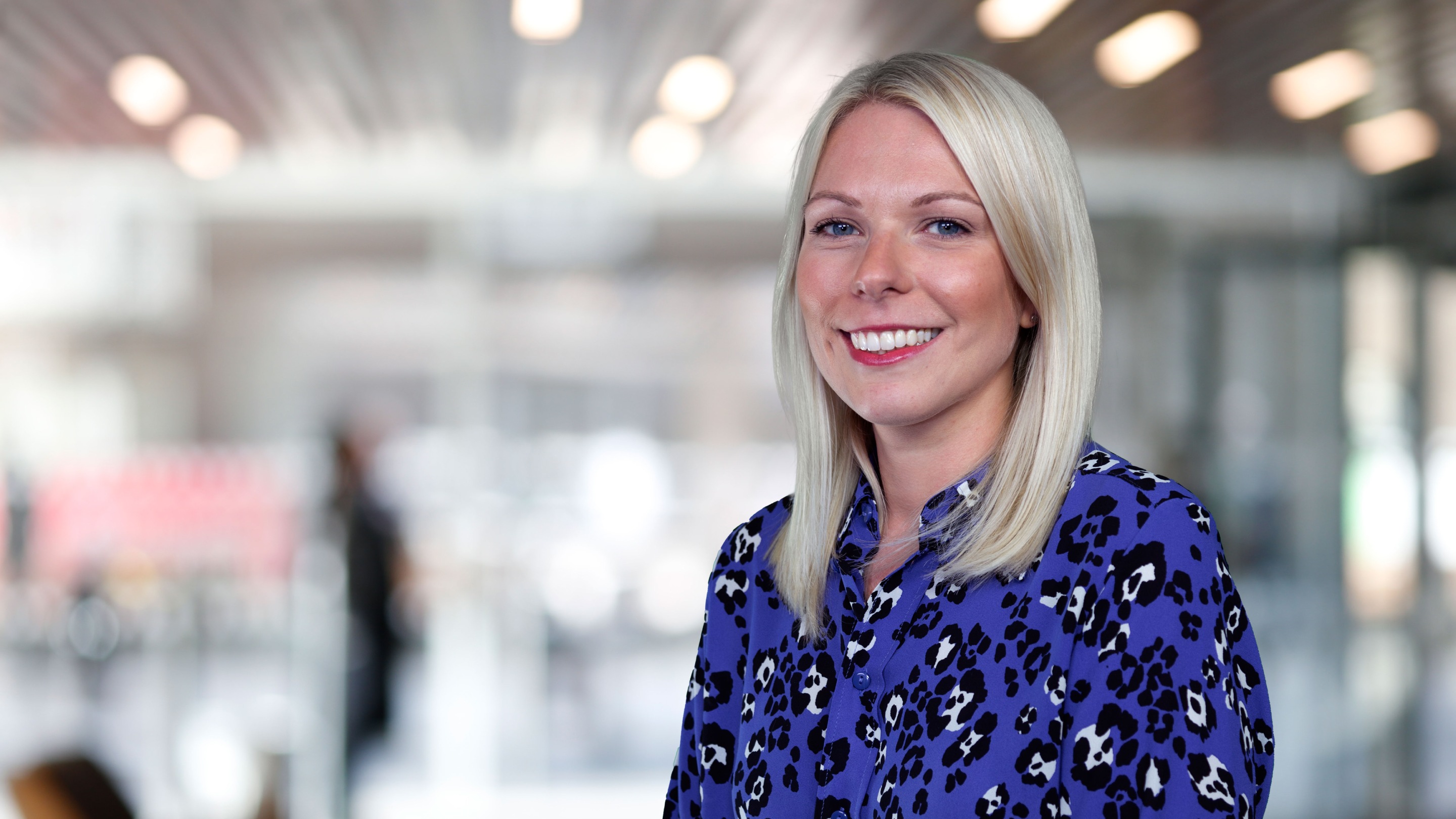 Aviva colleague, Emma Thomas, stood in our London office smiling