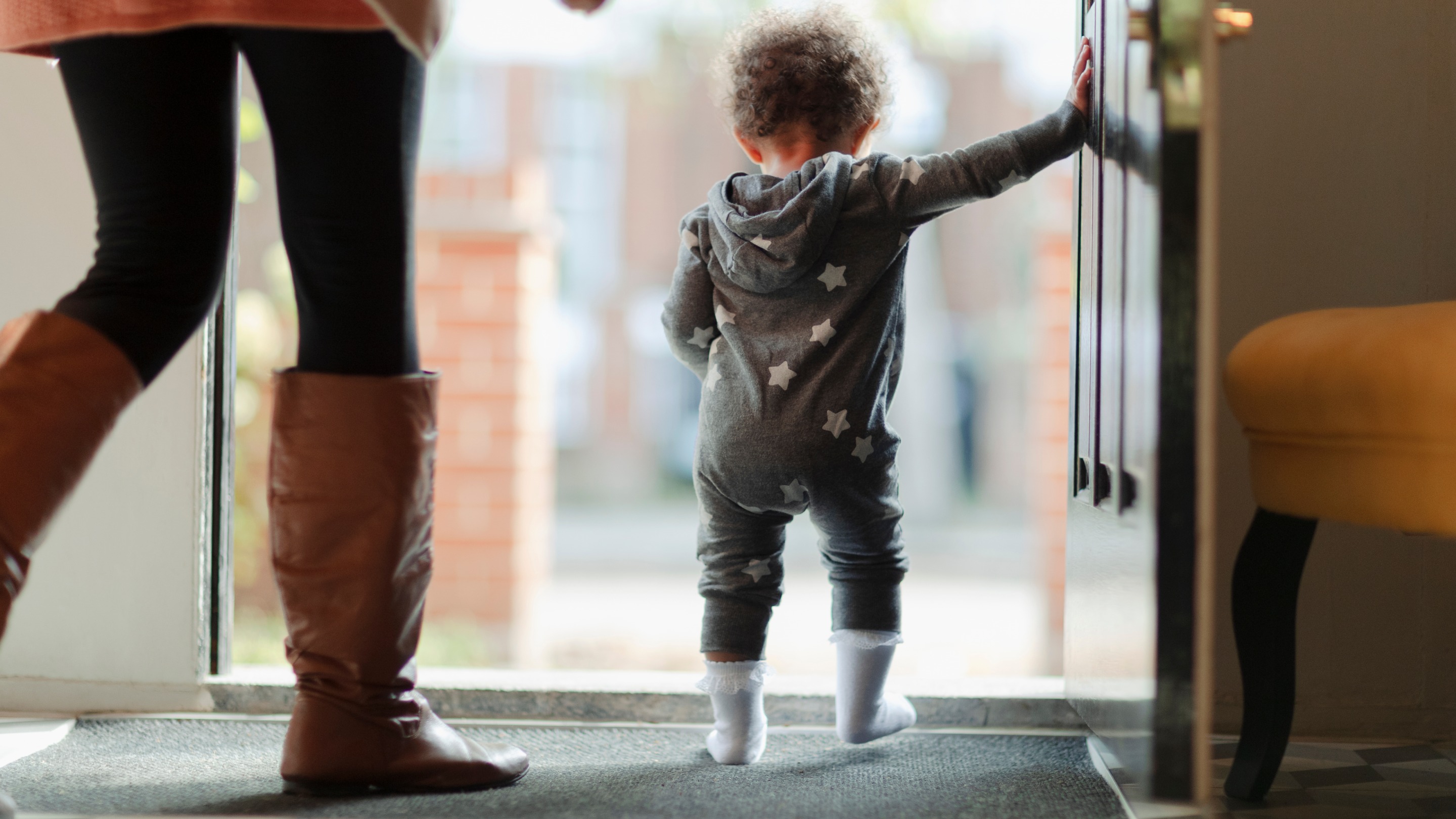 Mother and baby daughter in open doorway