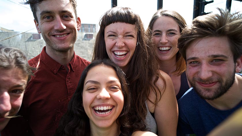 Young people smiling at the camera