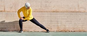 person performing yoga infront of a mirror