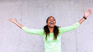 Happy woman with arms stretched out