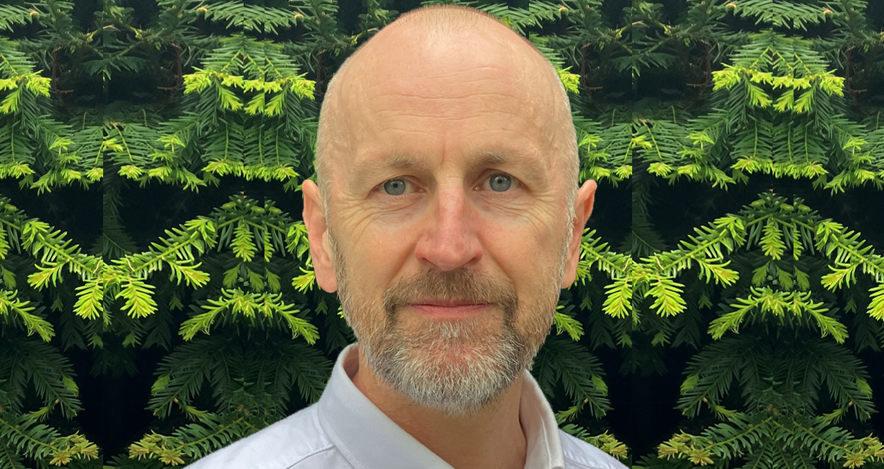 Photo of Steven Clivery, white male with beard against a green head background