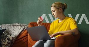 woman looking at bank card