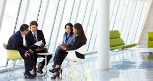 Four colleagues sat together having a discussion