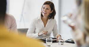 Smiling woman in a meeting