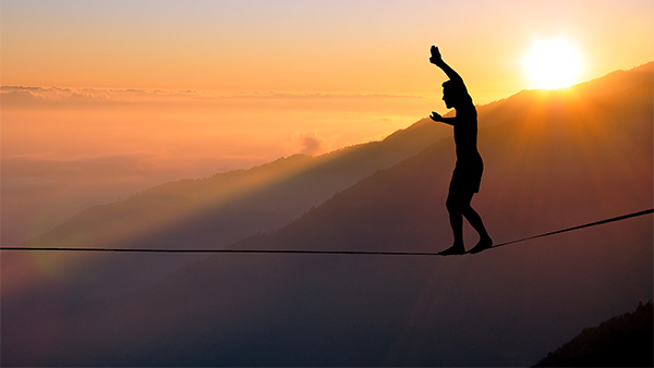 man on tightrope