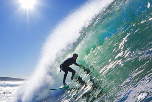 A surfer surfing on a large wave