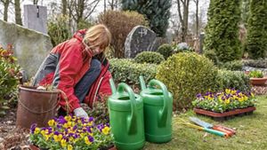 Woman tending to a grave