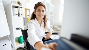 Disabled woman at her desk