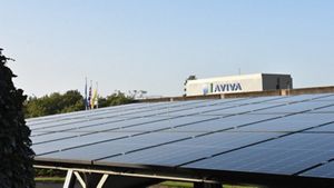 Roof covered in solar panels with the Aviva logo emblazoned
