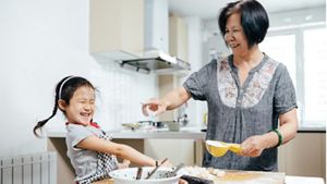 Grandmother and granddaughter baking