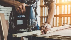 Man cutting wood
