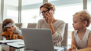 Parent working at home with children