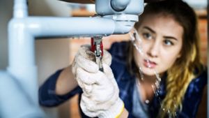 Woman fixing a broken sink