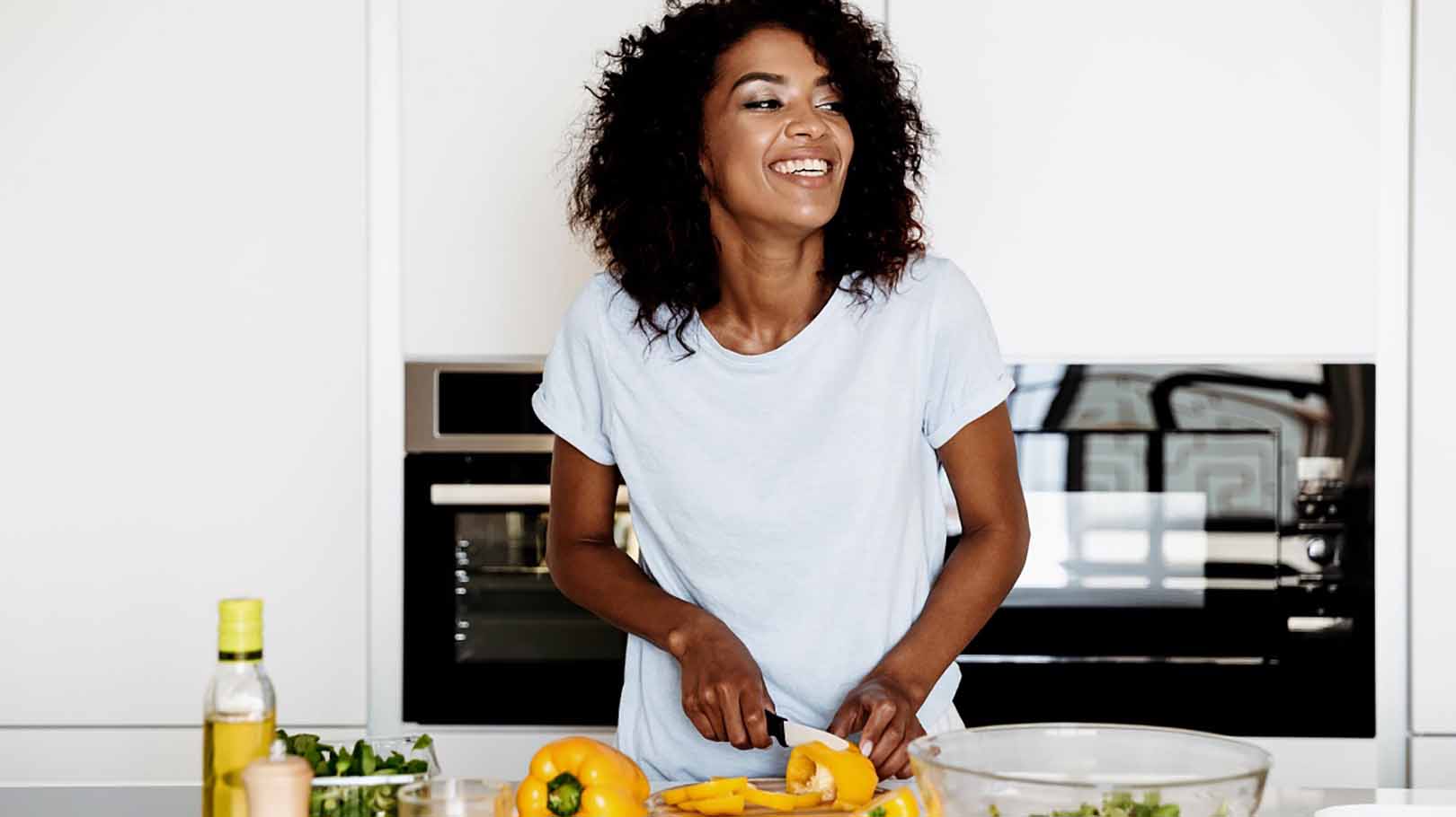 Lady preparing a healthy meal in a kitchen