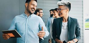 Business travel insurance takes the worry out of travelling – happy male and female colleagues travelling for work