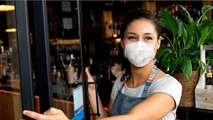 A picture of a masked cafe worker