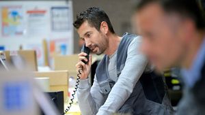 A picture of a man talking on the phone