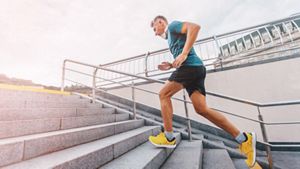 Person jogging up some stairs outdoors