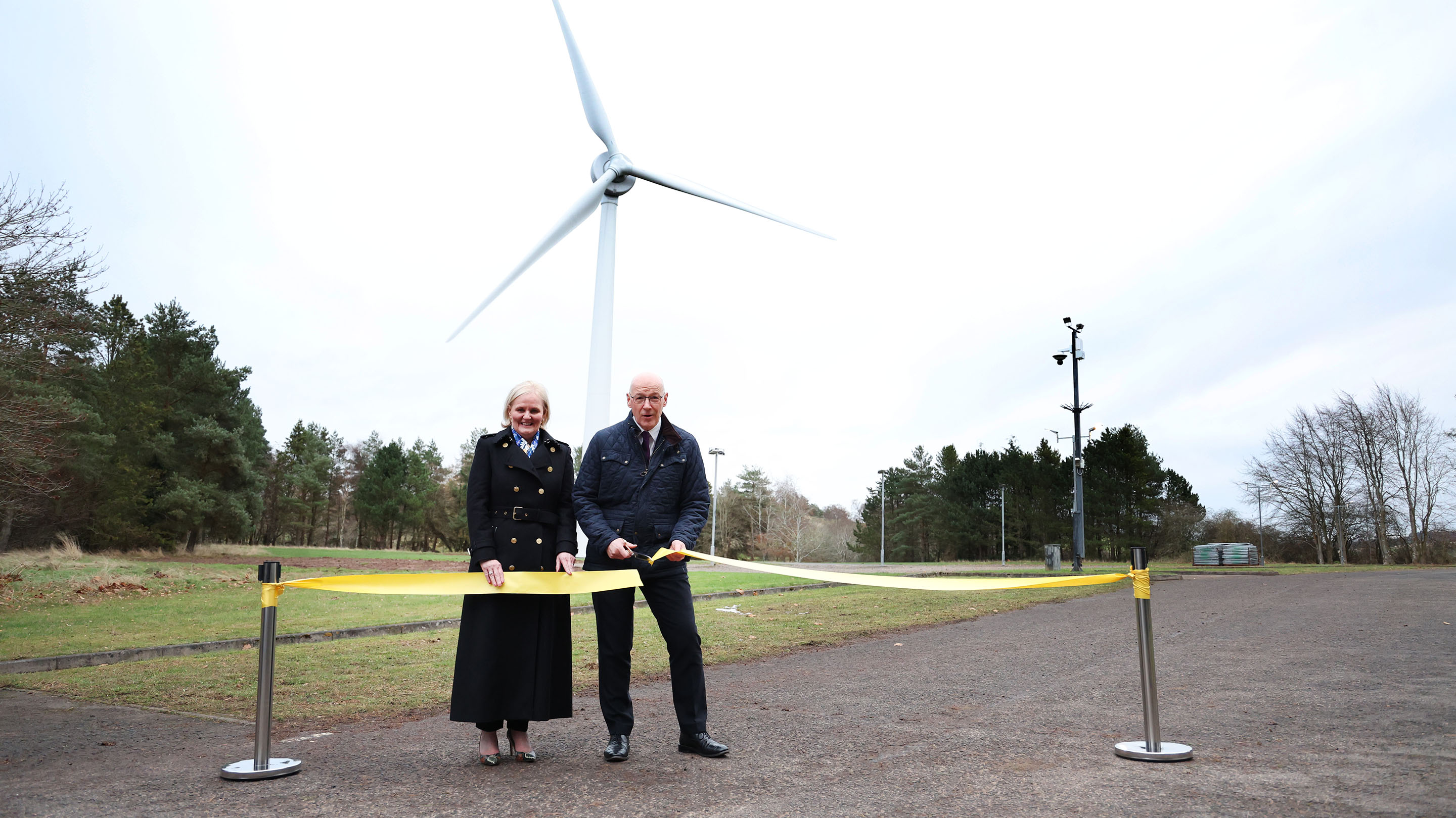 Amanda Blanc DBE and the Rt Hon John Swinney MSP cutting the yellow ribbon