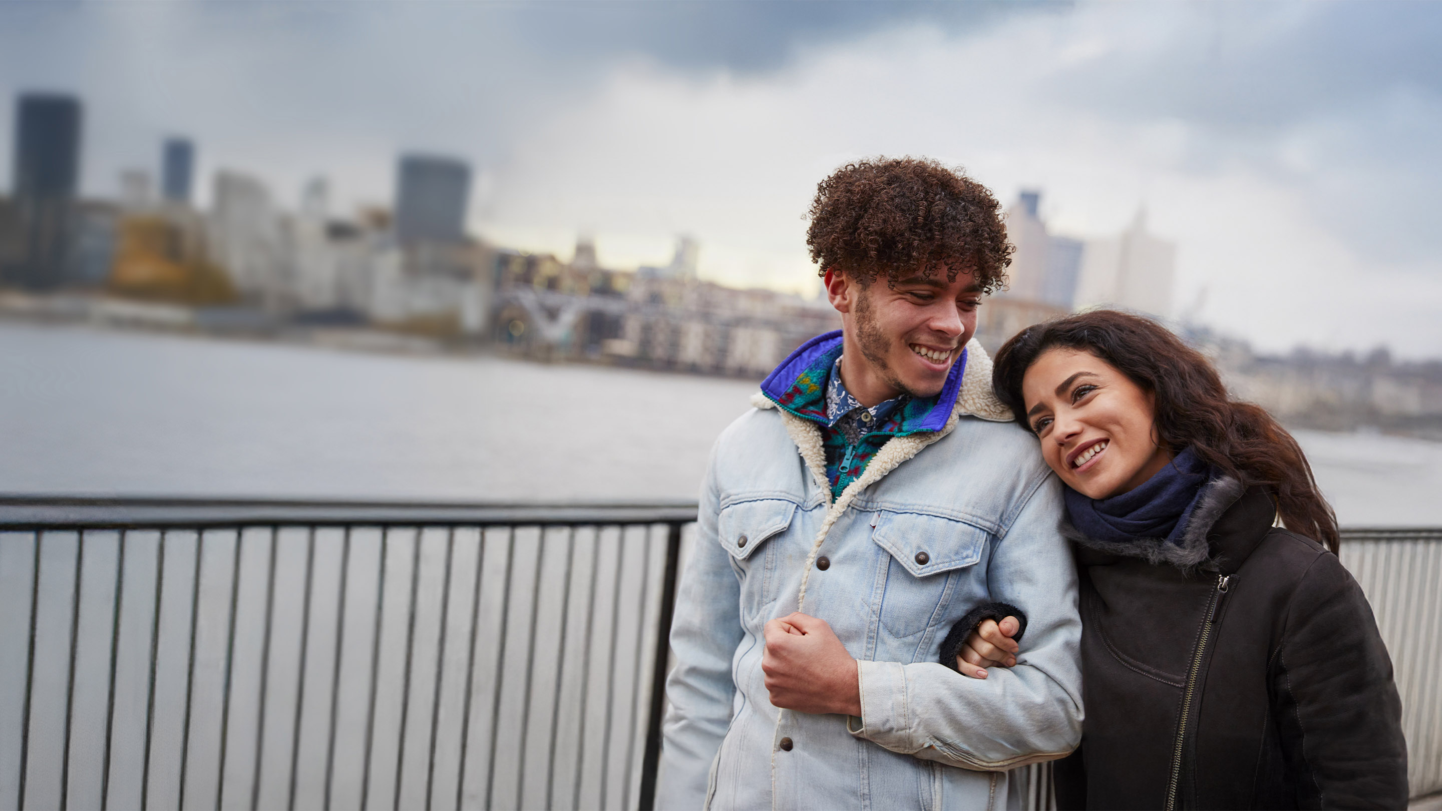 Couple walking together, arm in arm