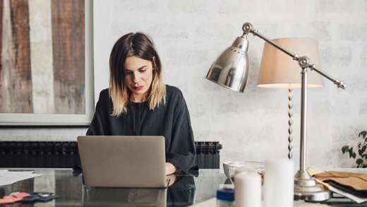 Women working on laptop in home office