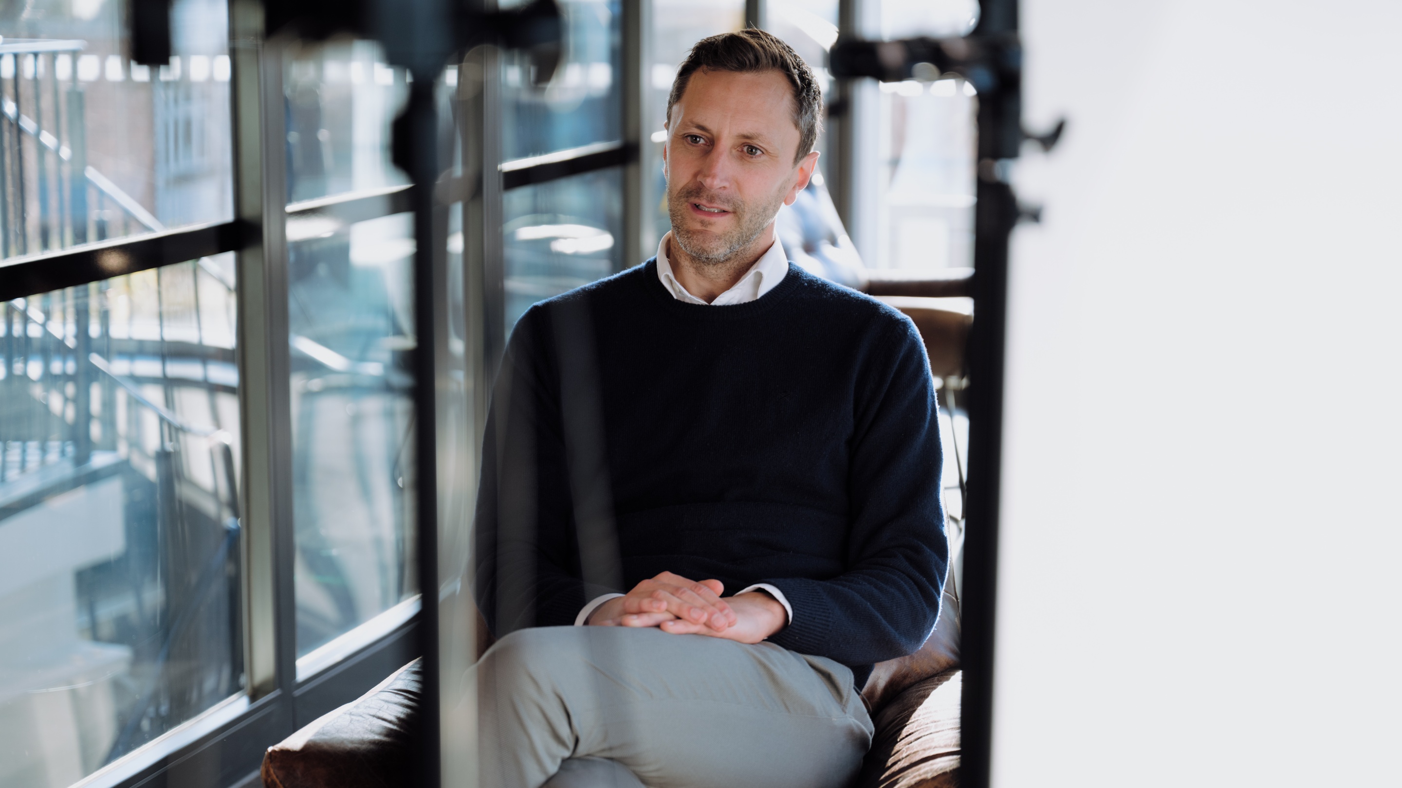 Alex in talking to a colleague in our London office