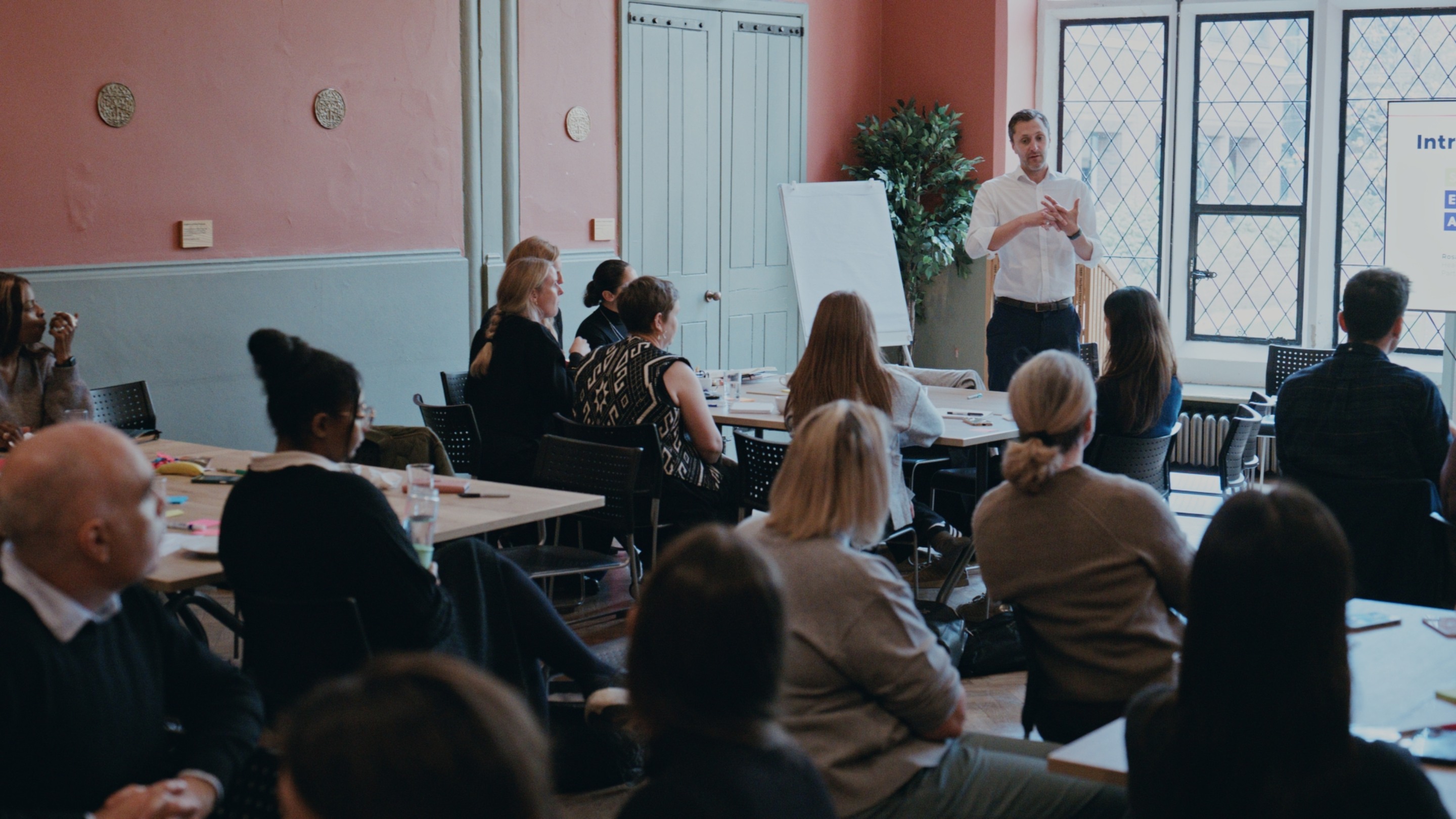 Alex speaking at a learning day with partners
