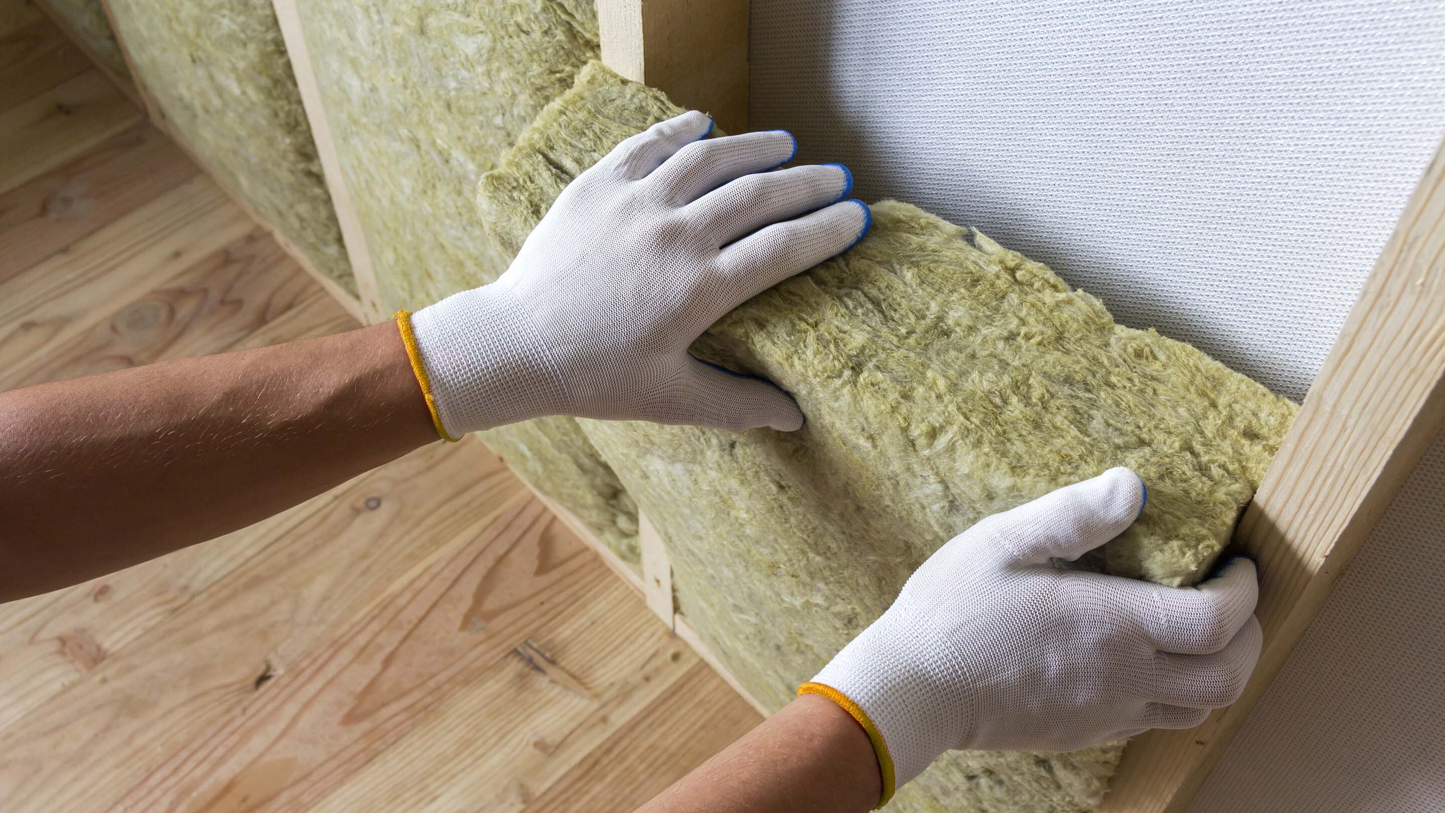 Insulation being installed in a home