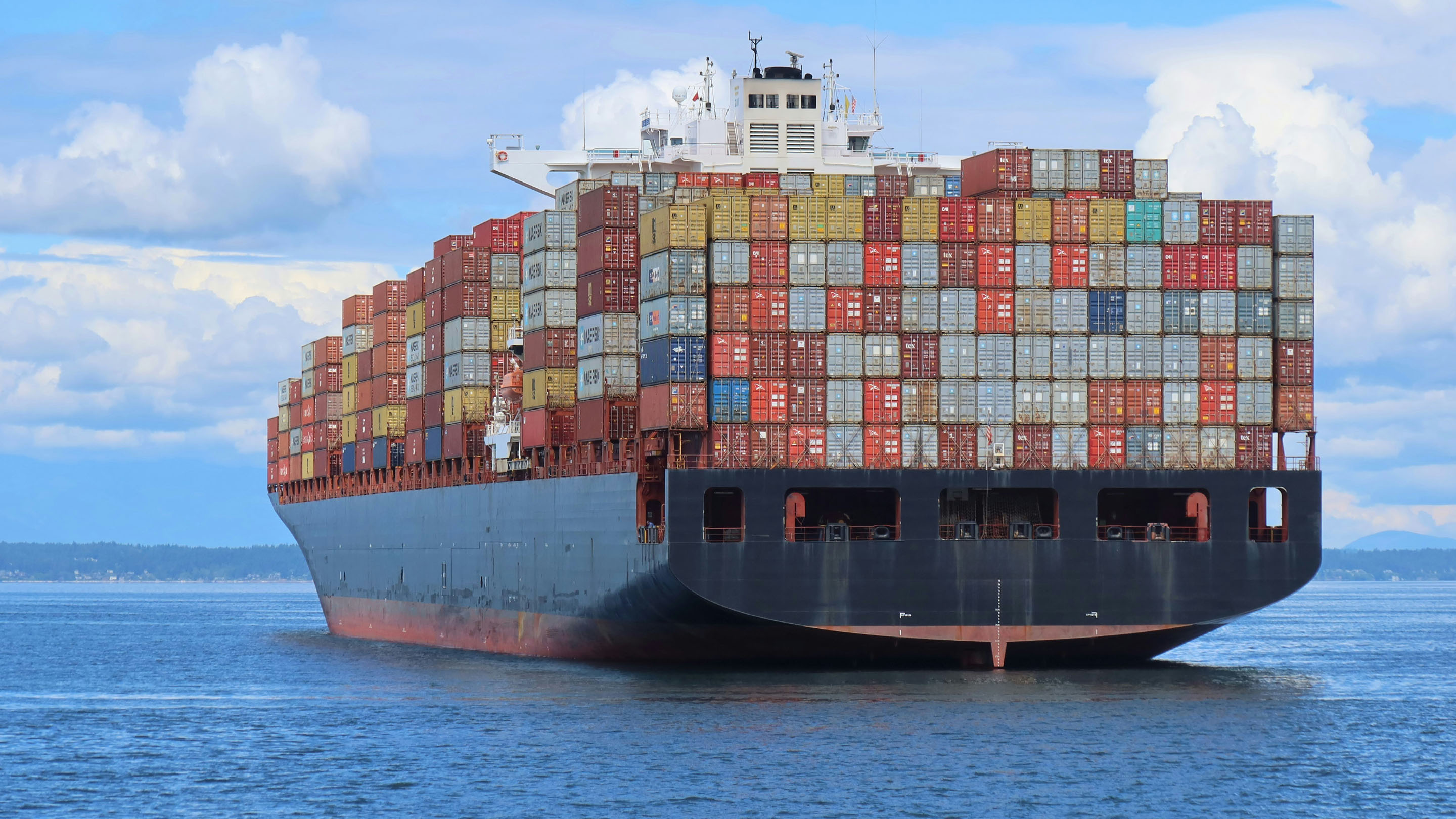 Container ship carrying lots of colourful containers