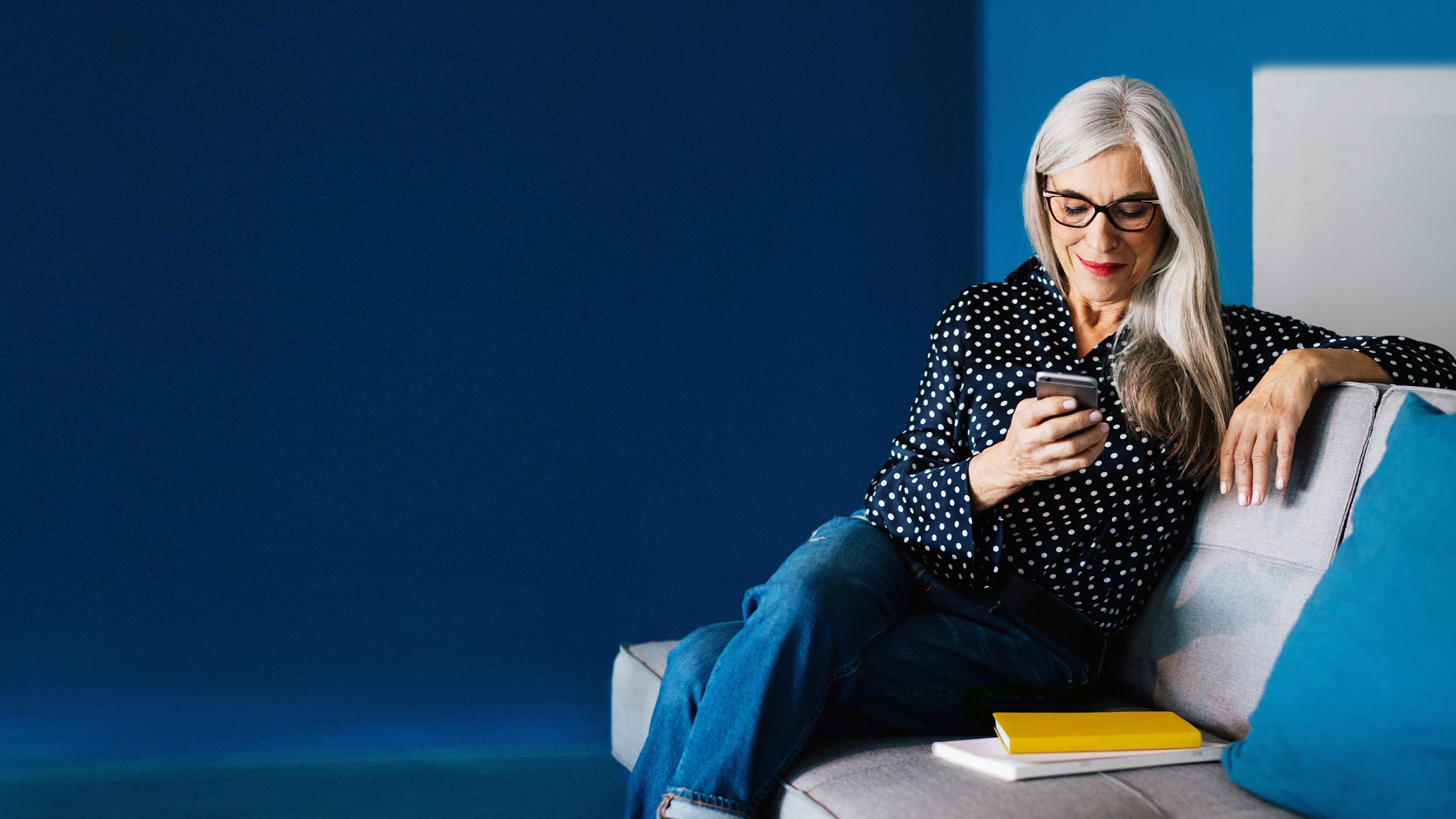 Older woman reading from a smart phone