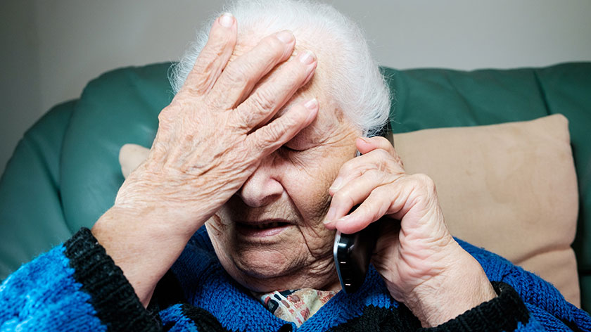 image of a senior lady on the phone and looking frustrated