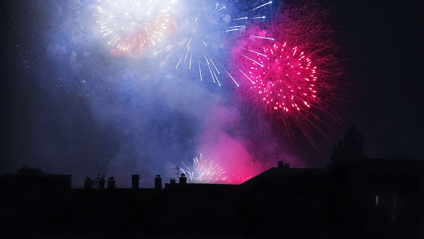 An image of fireworks over houses