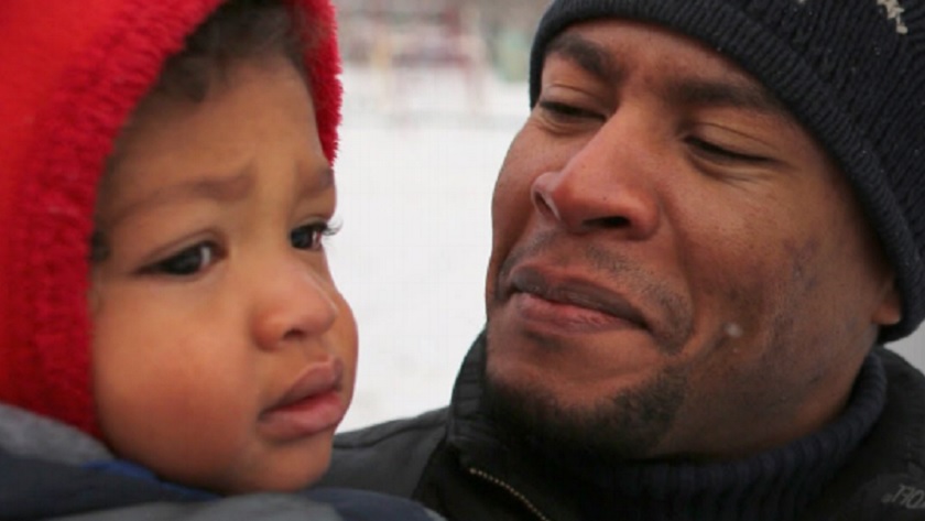 Close up image of a father and son.