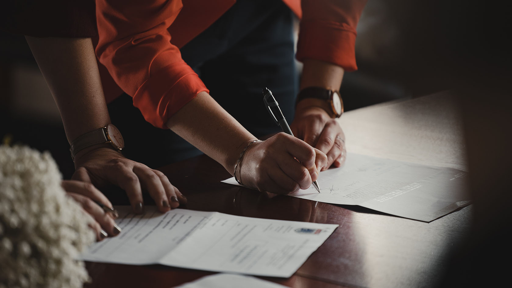 Stock image of people signing a contract