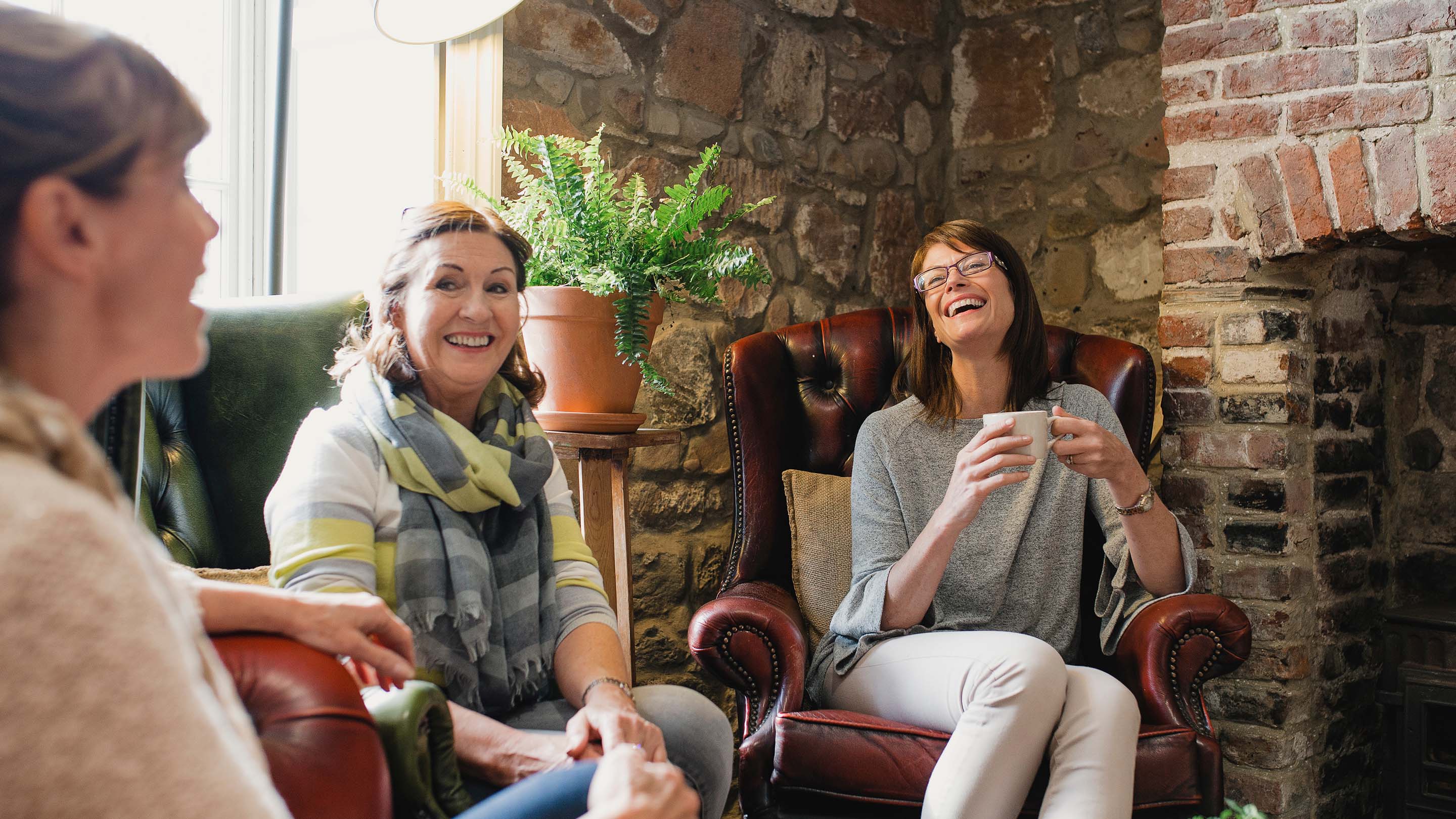 Female friends catching up over coffee