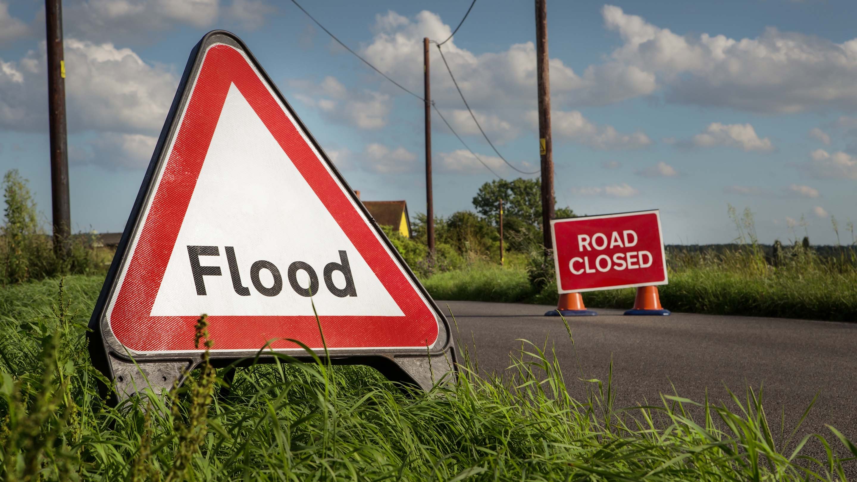 Flood warning sign on a road