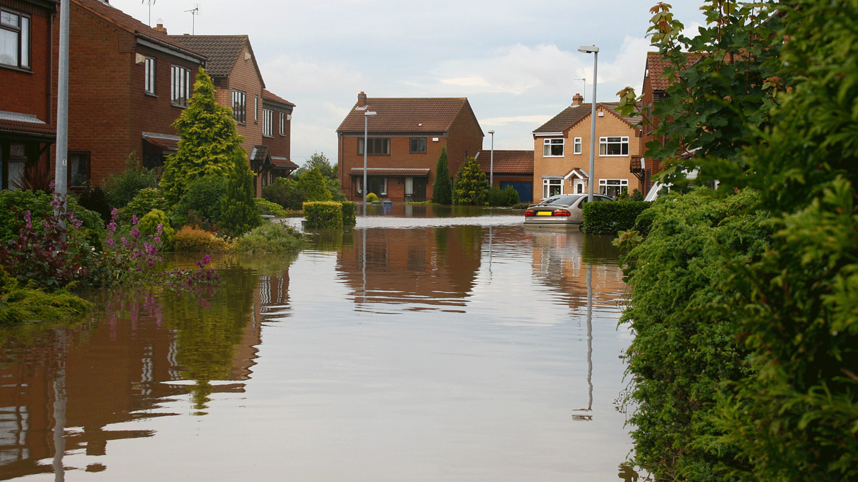Flooded housing street from Storm Eunice
