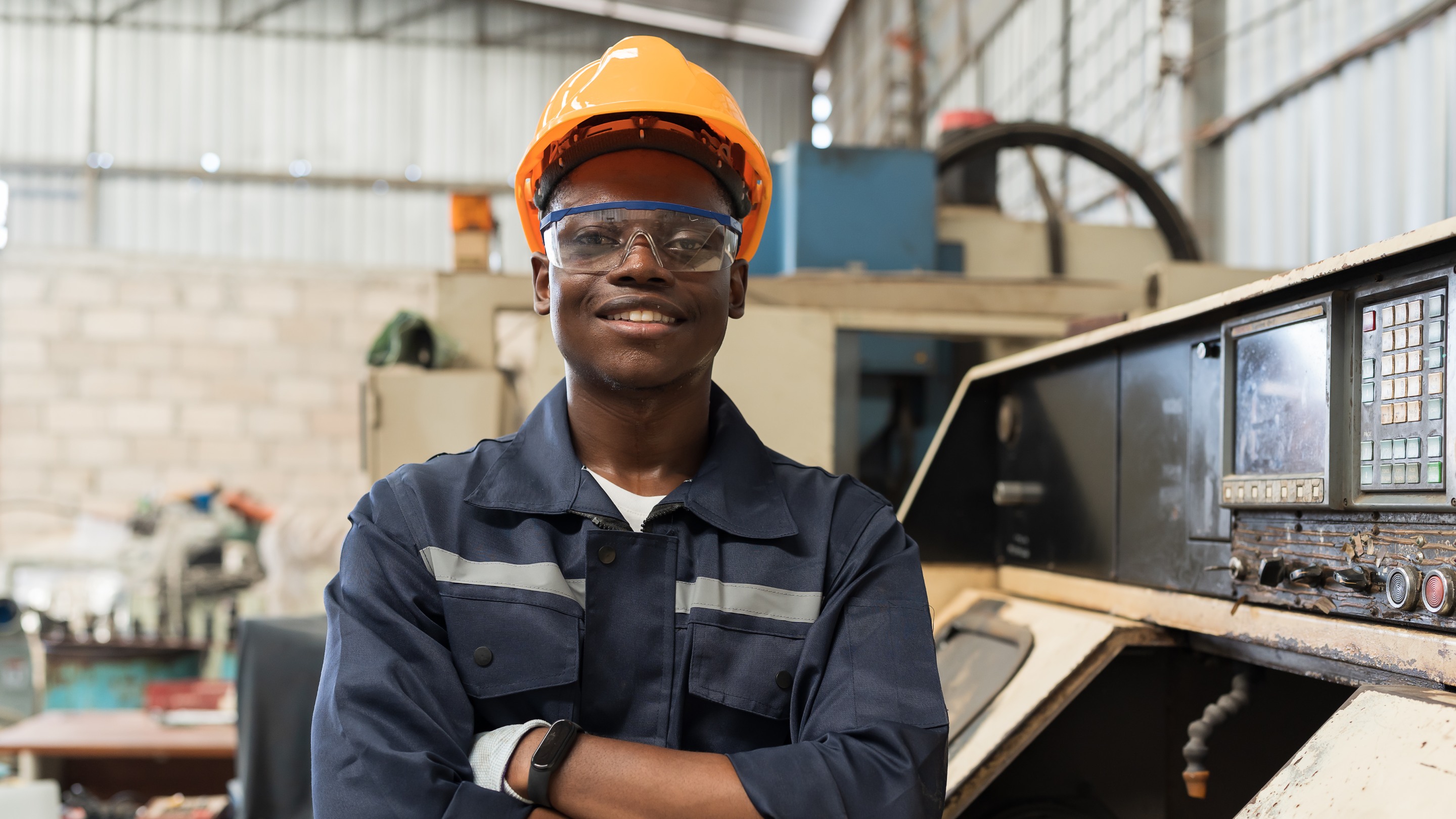 Male engineer standing in industrial factory
