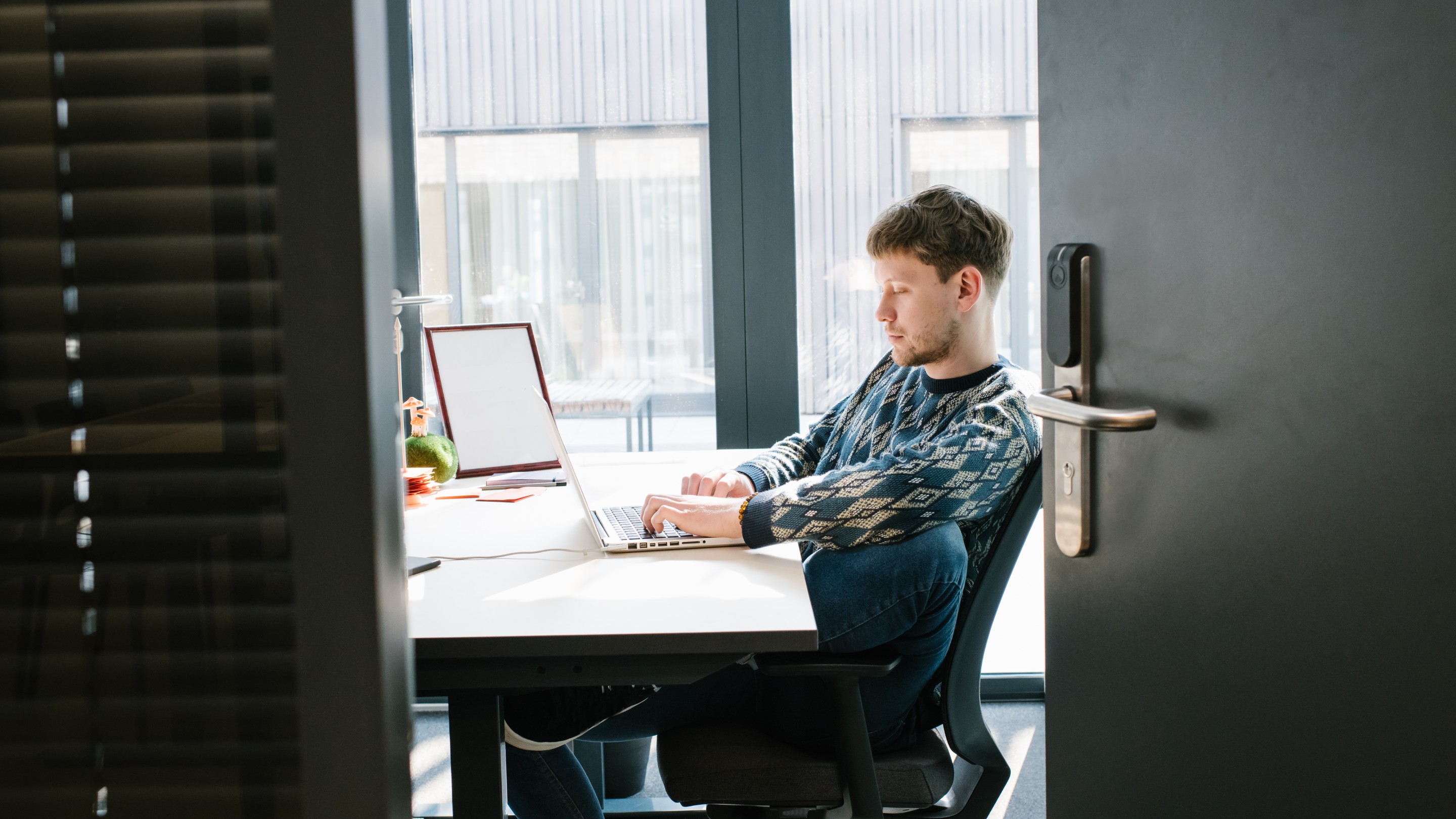 Man working on laptop at desk