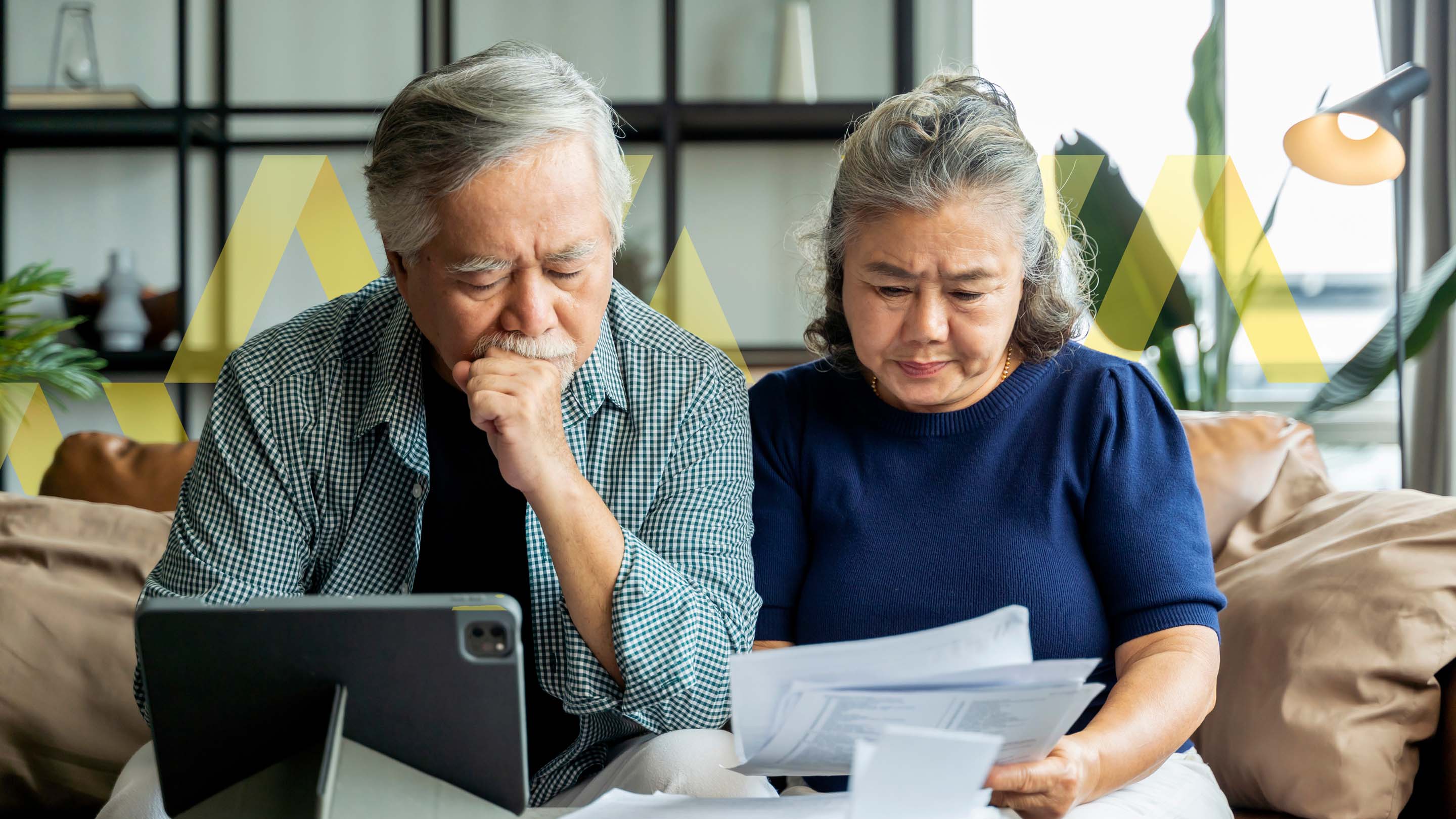Older retired couple reviewing bills