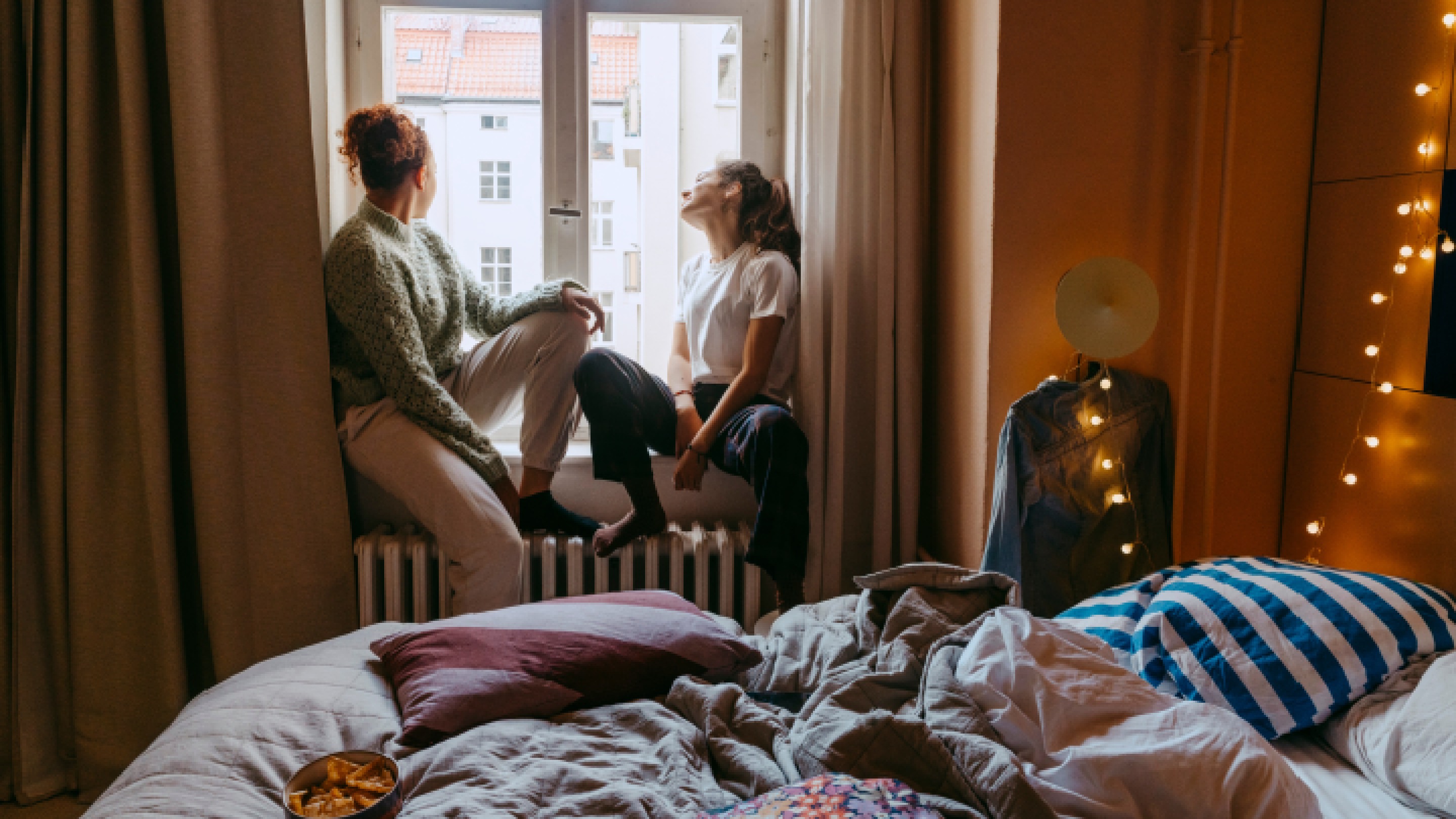 Friends sitting at window