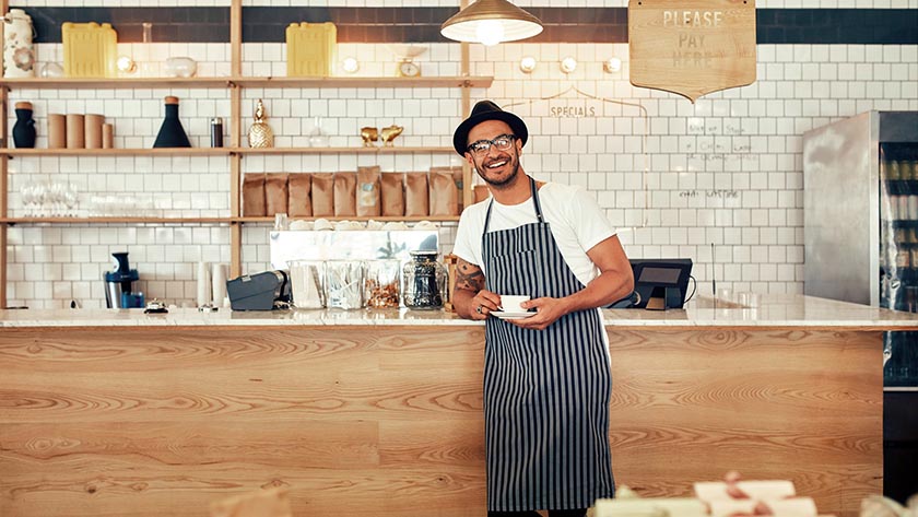 Image of a man working in a cafe. 