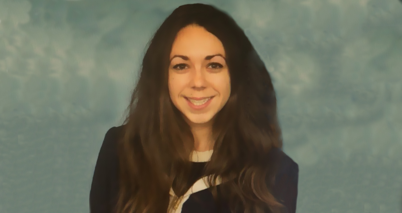 Headshot of Brianna Saraceno female smiling with long dark hard