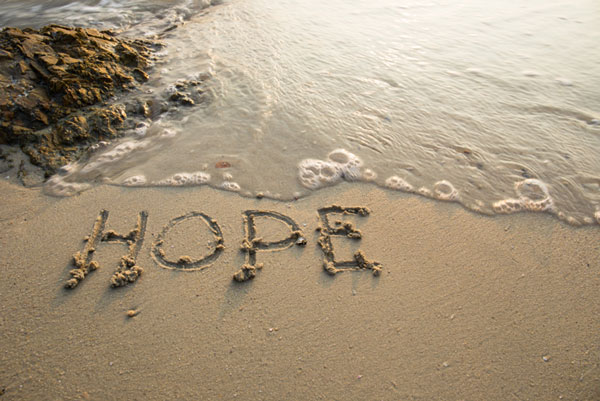 picture - Hope written in the sand on a beach