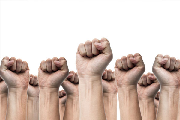 a picture of multiple raised fists