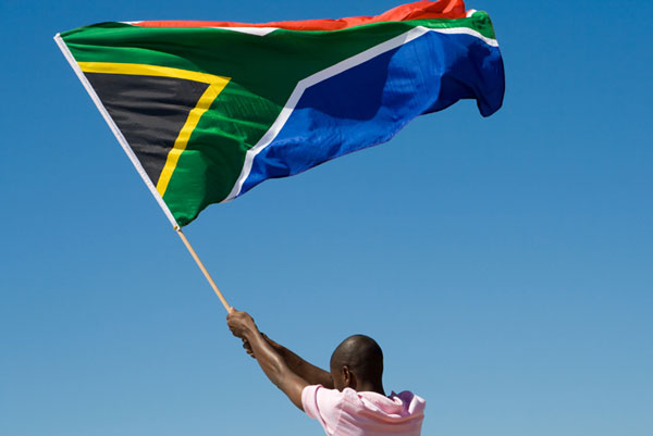 picture of someone waving the South African flag