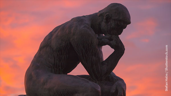 Sun setting behind Rodin's The Thinker