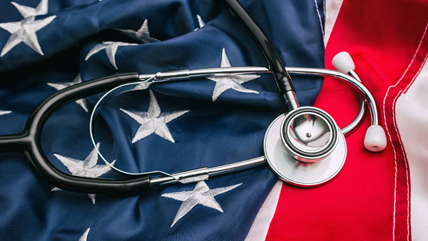 stethoscope on top of the american flag
