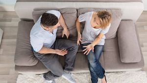 Couple discussing things on a sofa